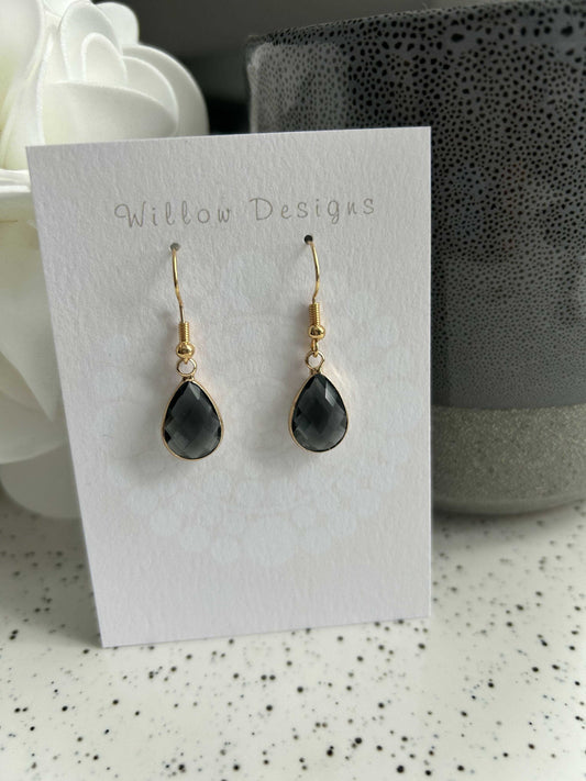 Charcoal Gemstone Dangly EarringsThe charcoal gemstone dangly earrings are 14K gold plated. They are hypoallergenic and nickel free.Charcoal Gemstone Dangly EarringsCG Pure Wash