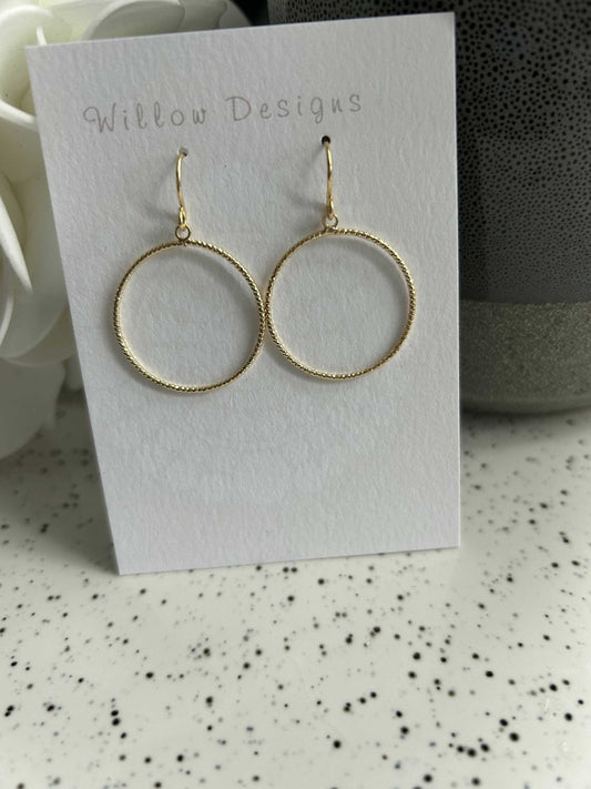 Textured Gold Circle Dangly EarringsJewelryBeautiful textured gold hoop dangly earrings.-14K gold plated-hypoallergenic -nickel freeTextured Gold Circle Dangly EarringsCG Pure Wash
